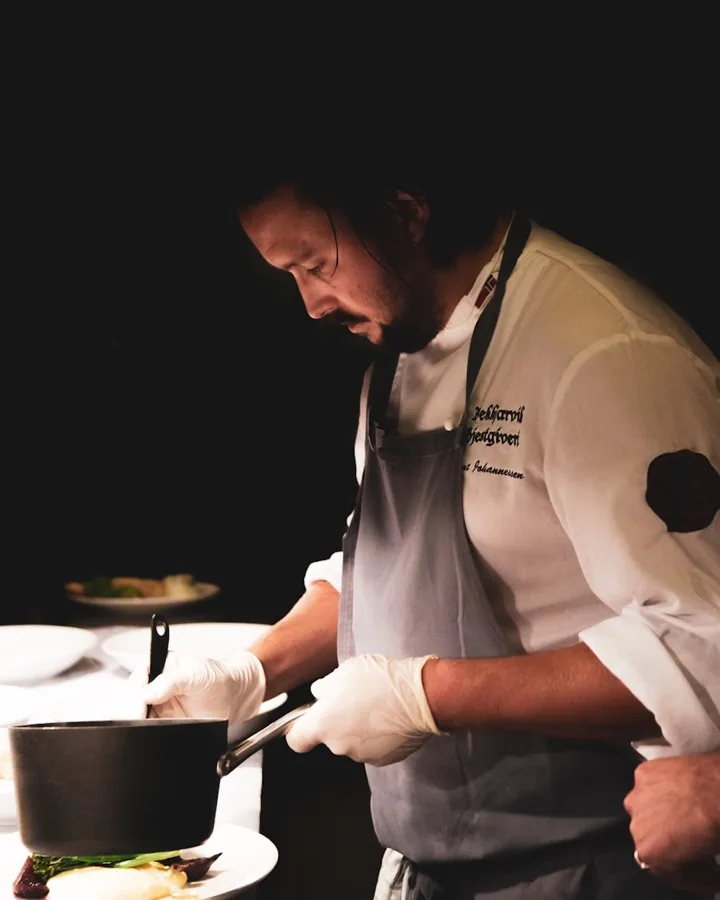 Chef plating a dinner course